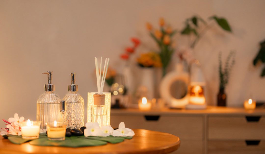 A spa wellness setup is shown with candles, flowers, and luxury treatment products, creating a calming ambiance.